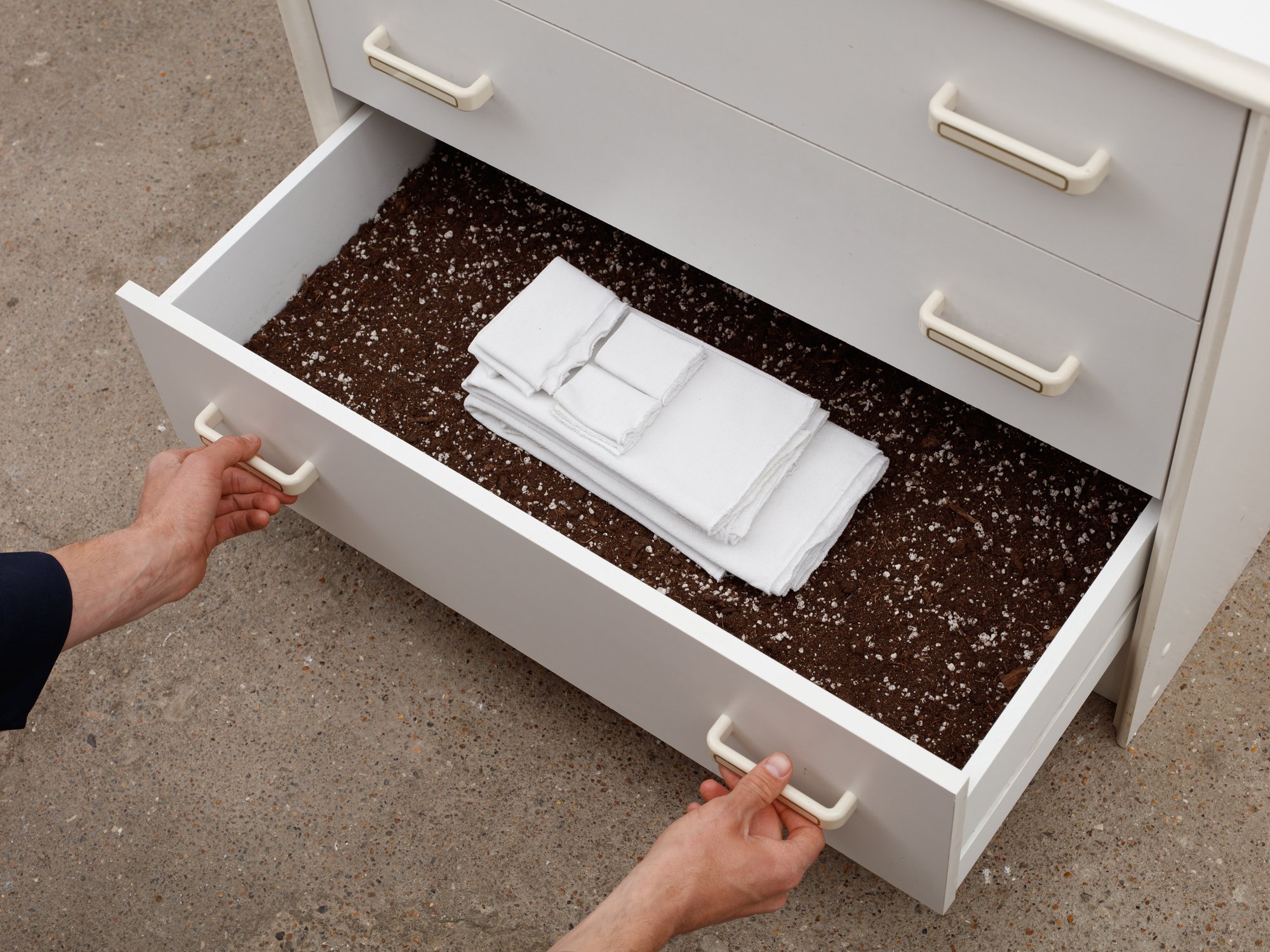Ian Law, untitled, chest of drawers, ceramic by Marianne Measures (1970-2010), potting soil, unpicked t-shirts, 69 x 76.5 x 40 cm (27 1/8 x 30 1/8 x 15 3/4 in), 2020
