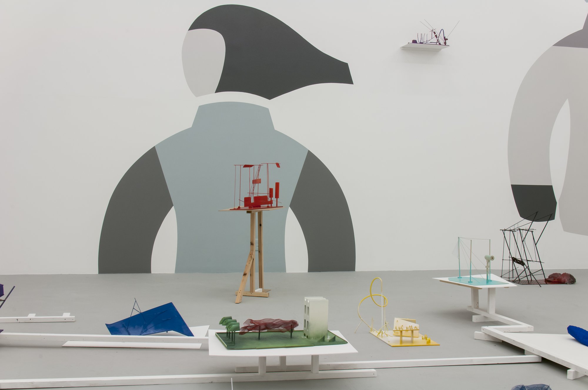 Emre Hüner, Floating Cabin Rider Capsule Reactor Cycle, wood, clay, paint, wall drawings, fabric, polyurethane, steel, various material, dimensions variable, 2015. Installation view, CCA Kitakyushu, 2015