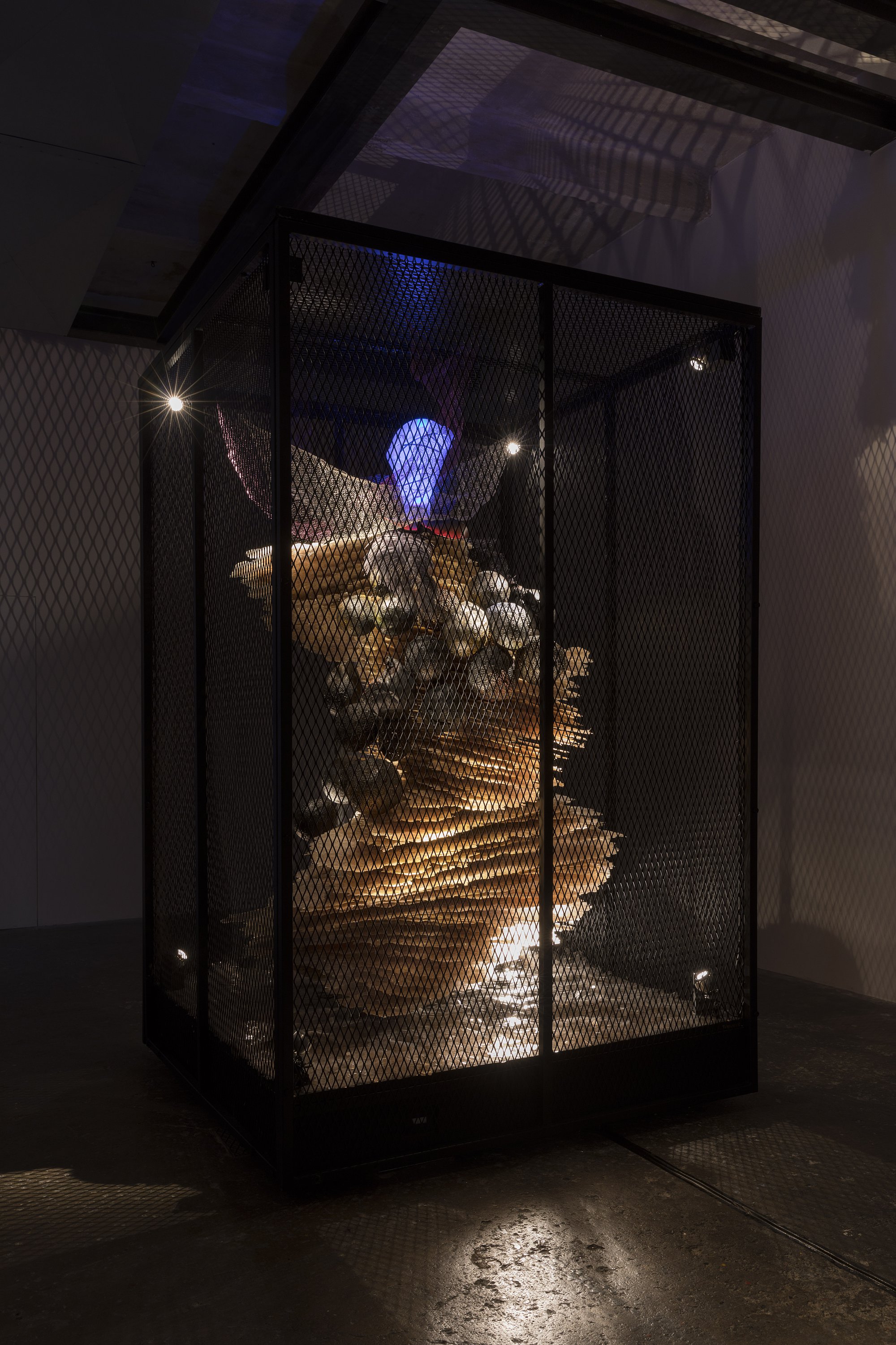 Liliane Lijn, The Bride, mixed media performing sculpture, steel mesh cage, blown glass, epoxy bonded mica, ostrich feathers, lacquered papier-mâché balls, crocheted stainless steel and enamelled copper, forged iron, 244 x 244 x 153 cm, 1988. Installation view, I AM SHE, Ordet, Milan, 2020
