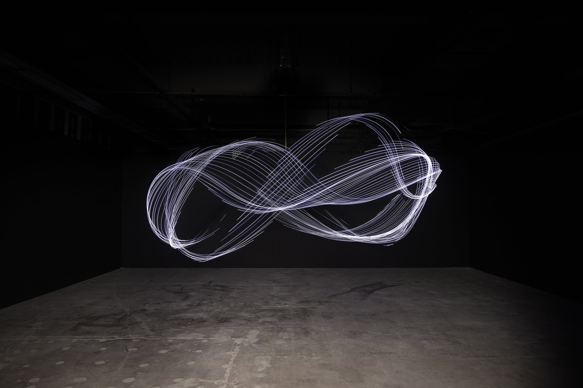 Liliane Lijn, Gravity’s Dance, black weighted cloth, LEDS, Forex central stiffener, 3 phase motor, inverter, control system, ∅ 600 cm (∅ 236 1/4 in), 2019