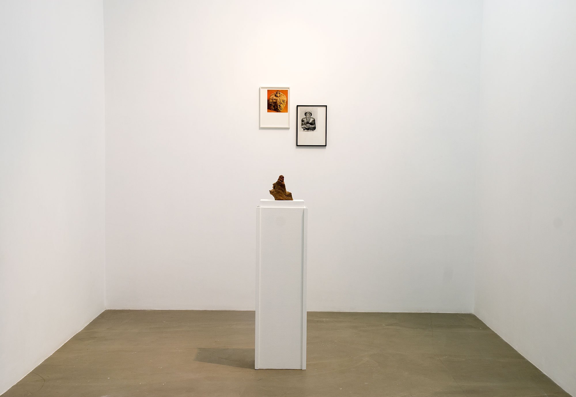 Haris Epaminonda, Untitled #02 l/g, two framed found images, plinth, wooden carved bonze figure, dimensions variable, 2009. Installation view, VOL. IV, Rodeo, Istanbul, 2009