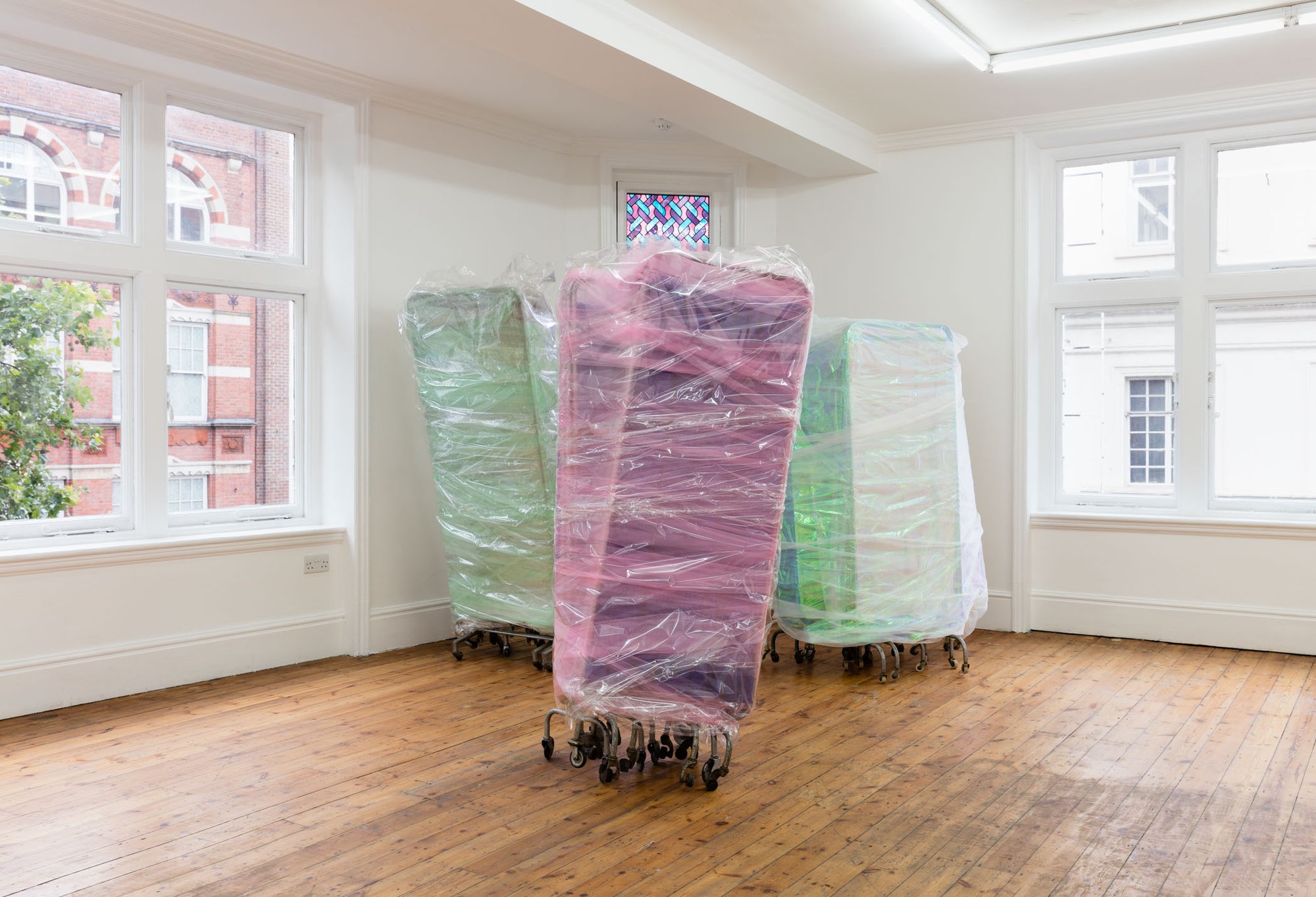 Ian Law, There was a body, I was there, was a body, medical privacy screens with soft toy fur fabric, curtain netting and organza, gift wrapped, 170 x 130 x 55 cm (66 7/8 x 51 1/8 x 21 5/8 in), 2016. Installation view, The Cypress Broke, Rodeo, London, 2016