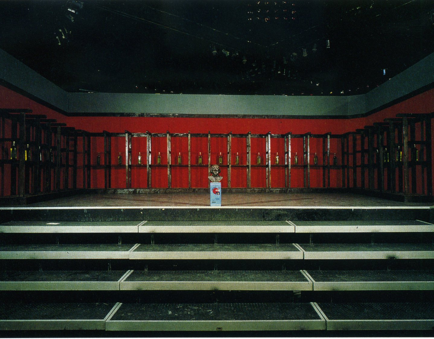 Thanasis Totsikas, Untitled, metal, red blankets, oil, wooden pews, 700 x 500 x 220 cm (275 5/8 x 196 7/8 x 86 5/8 in), 1988. Installation view, Hyper-product, Club 22, Athens, 1988